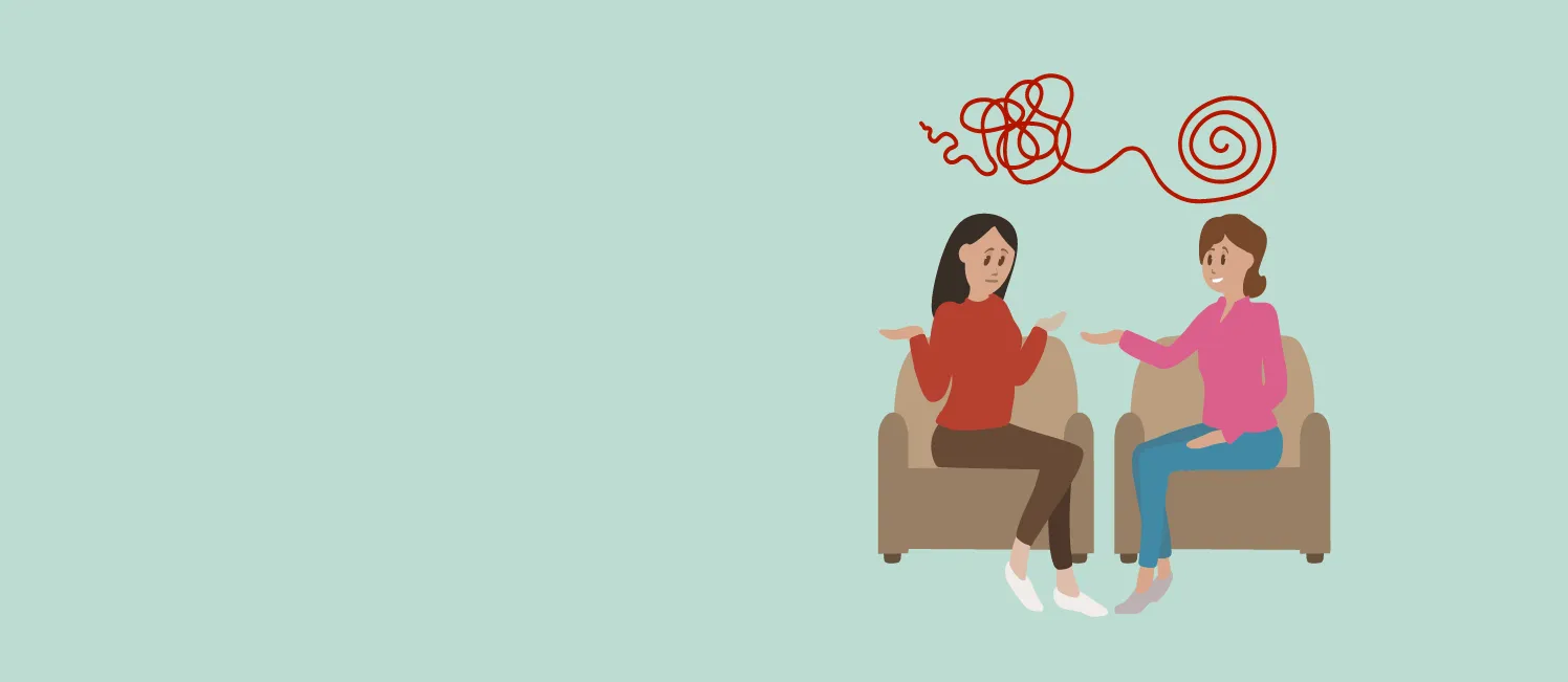 Zwei Menschen die sich sitzend unterhalten