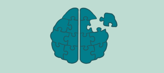 Ein Gehirn aus Puzzleteilen, wo ein Puzzelteil nicht verbunden ist